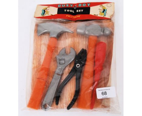 A rare 1950's unused set of ' Busy Boy ' made plastic toy tools. 'Empire Made'. Sealed, unused. Rare in such condition.


POS