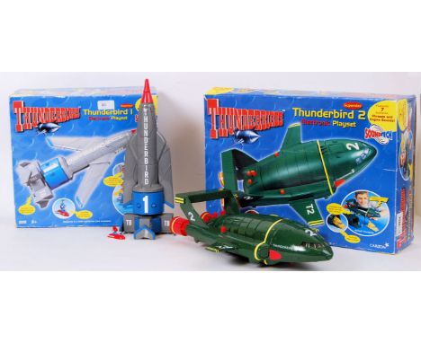 Two original Carlton licensed Thunderbirds Electronic Playsets - Thunderbird 1 and Thunderbird 2. Both with original boxes.

