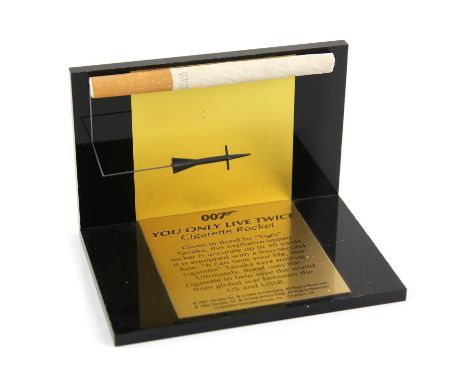 James Bond You Only Live Twice - Replica Cigarette Rocket by Danjaq on black plinth with gold plaque, approximately 3 x 3 x 4