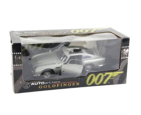 James Bond 007 - An Autoart 1:18 scale Aston Martin DB5, modelled on the vehicle in the film Goldfinger, boxed, overall size 