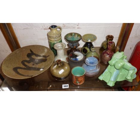 Shelf of studio and retro pottery, including an Art Deco horse and figure