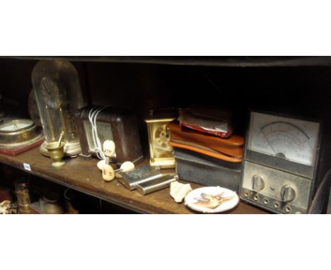 Shelf of assorted clocks etc