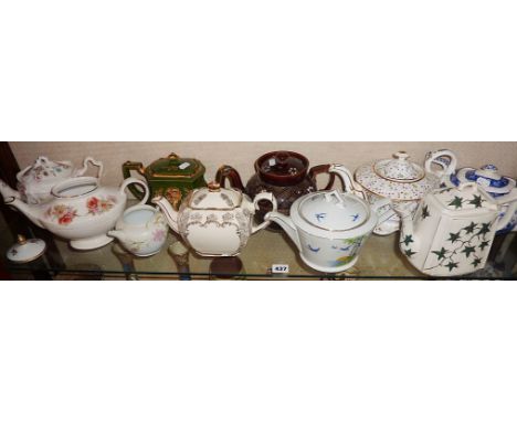 Shelf of vintage and older china teapots (10)