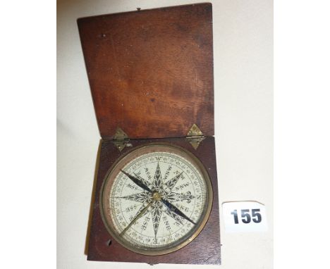 Old compass in wooden case
