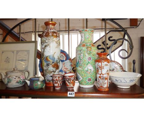 Shelf of miscellaneous Chinese and Japanese porcelain, inc. vases, plates, teapots etc.