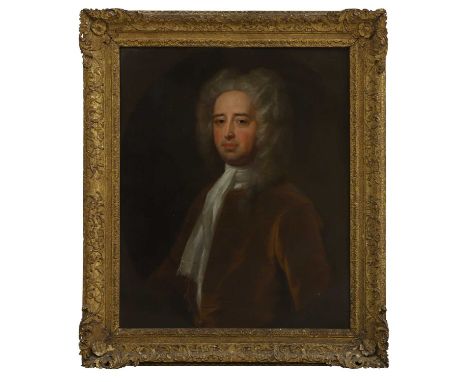 Circle of John Vanderbank (1694-1739) Portrait of a gentleman, half-length, in a brown coatoil on canvas, painted oval 76 x 6