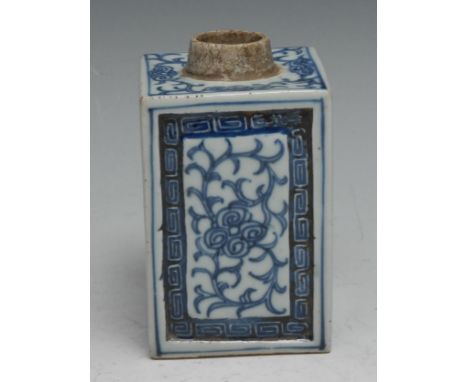 An 18th century Chinese square tea caddy, painted in tones of underglaze blue with scrolling foliage within trellis borders, 