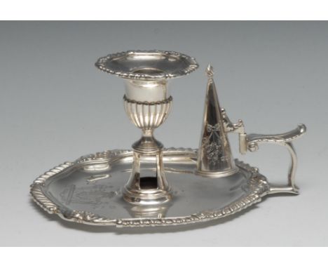 A George III silver shaped circular chamber stick, gadrooned leafy scroll borders, half-fluted sconce with nozzle, scroll han