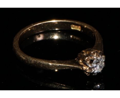 An 18ct gold diamond solitaire ring, the brilliant cut stone claw set in platinum, size L, 2.6g 