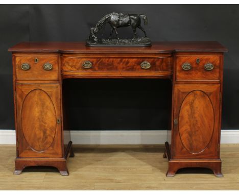 A 19th century mahogany breakfront sideboard, slightly oversailing top with reeded edge above three frieze drawers and a pair