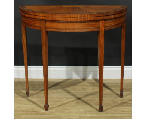 A 19th century satinwood demilune card table, hinged crossbanded top inlaid with radiating veneers and a batwing patera enclo