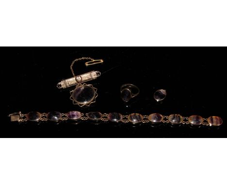 A late 19th/early 20th century 9ct gold mounted composed suite of Blue John jewellery, comprising a ring with polished oval c