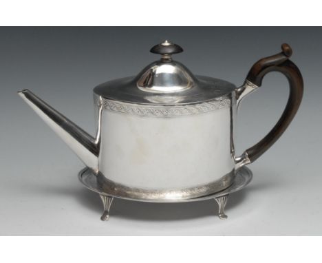 A George III Scottish silver oval teapot and stand, bright-cut engraved with borders of leafy Vitruvian scrolls, the teapot w