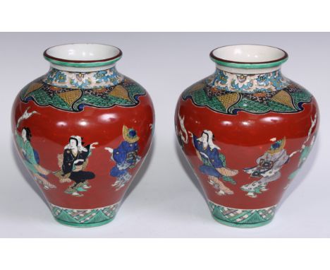 A pair of Japanese ovoid vases, painted in polychrome with figures on a cinnabar ground, 26cm high, seal marks, Meiji period 