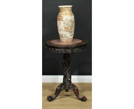 A Chinese hardwood tripod occasional table, circular top with inset marble panel above a shaped frieze pierced and carved wit