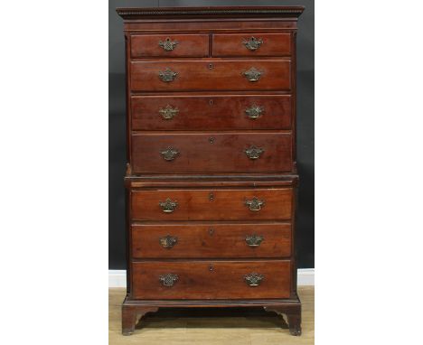 A George III mahogany chest on chest, dentil cornice above two short and three long graduated drawers, the base with a slide 
