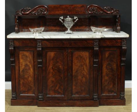 An early Victorian mahogany breakfront side cabinet, shaped superstructure with shallow shelf, marble top above three frieze 