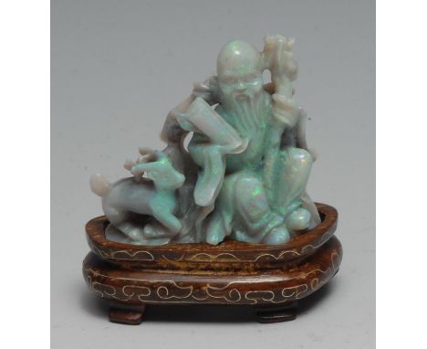 A Chinese carved opal figure group, Shou Lao and deer, inlaid hardwood stand, 7cm high overall 