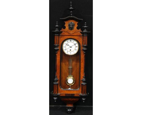 A 19th century walnut and ebonised Vienna timepiece, 13cm enamel clock dial inscribed with Roman numerals, 99cm high 