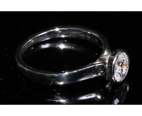 A platinum diamond solitaire ring, approx. 0.6ct, size J, marked 950, 3.85g 