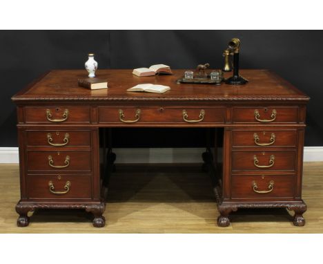 A large George III Revival mahogany partners’ desk, rectangular top with gadrooned edge and inset tooled writing surface abov