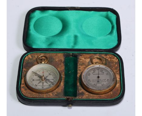 An early 20th century gilt brass travelling pocket aneroid barometer and compass, 4cm silvered registers, 6.5cm over loop, re