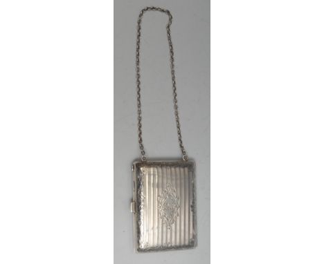 An early 20th century silver rounded rectangular lady’s evening companion, hinged cover enclosing a double sovereign case, ca