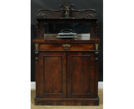 A Victorian rosewood chiffonier, shaped mirrored superstructure carved and applied with leaves, rectangular top above a long 