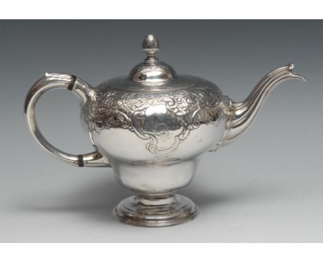 A George II Scottish silver bullet shaped teapot, chased in the Rococo taste with flowers and leafy scrolls, hinged domed cov