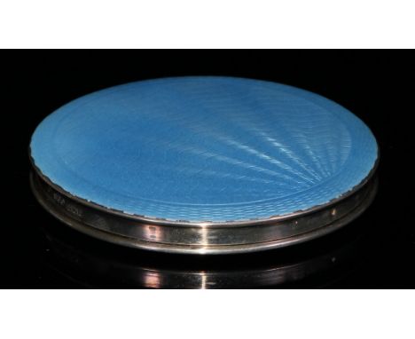 A George VI silver and engine turned powder blue enamel circular compact, hinged cover with interior mirror, original mesh an