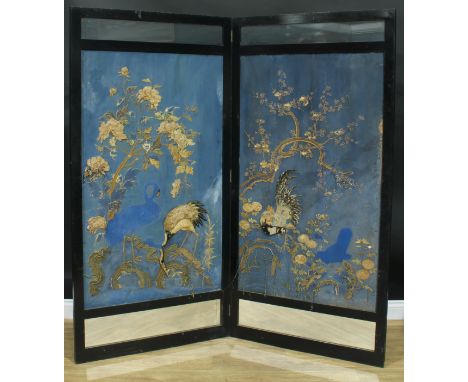 An Aesthetic period ebonised two-fold screen, set with Chinese textile panels on a blue painted ground, 179.5cm high, each pa