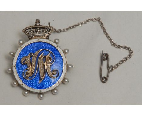 Royalty - a Victorian gold coloured metal, seed pearl and guilloche enamel brooch, presumably a royal presentation, the crown