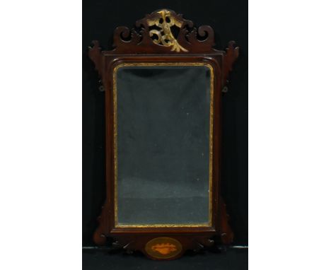 A George II Revival parcel-gilt mahogany Vauxhall looking glass, bevelled mirror plate, shaped cresting centred by a hoho bir
