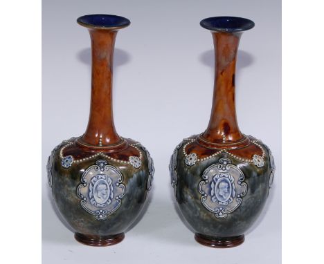 A pair of Royal Doulton stoneware ovoid vases, sprigged with cameo portrait ovals on a mottled ground, flared elongated necks
