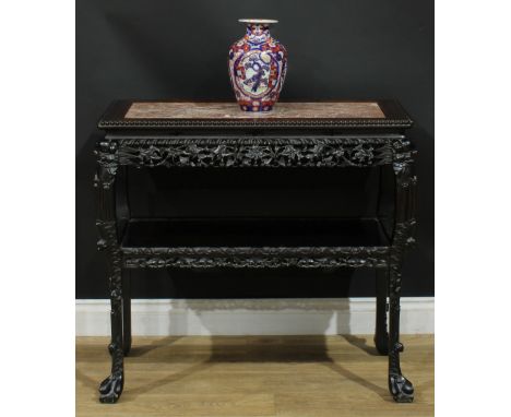 A Chinese hardwood porcelain table, rectangular top with beaded border and inset marble panel above a shaped frieze pierced a