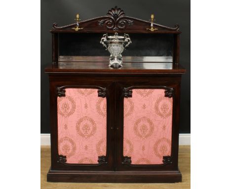 An early Victorian rosewood chiffonier, shaped superstructure with rectangular mirror, the base with a pair of panel doors en