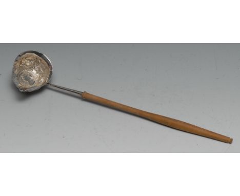 A George III silver toddy ladle, 31cm long, apparently unmarked, the bowl set with a Queen Anne shilling of 1709 