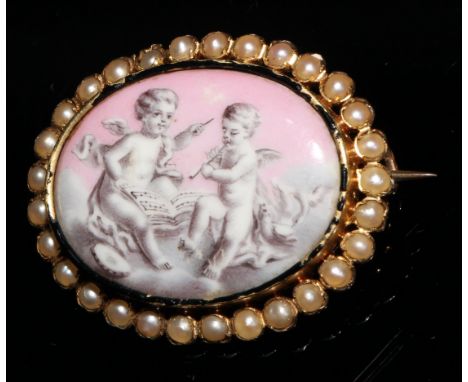 A Victorian gold oval brooch, set with a Bilston type panel painted in sepia tones with a pair of putto on a pink ground, the