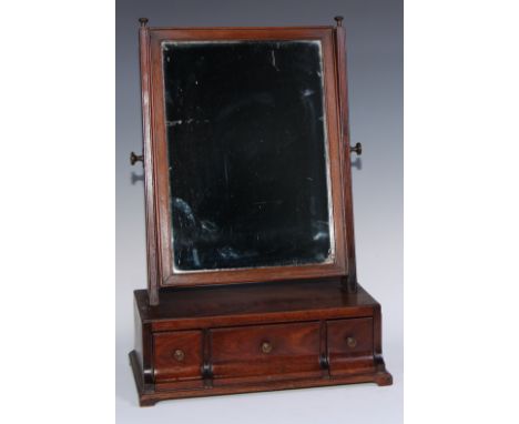 A George III mahogany dressing glass, rectangular mirror plate, the base with three drawers, shallow bracket feet, 57.5cm hig