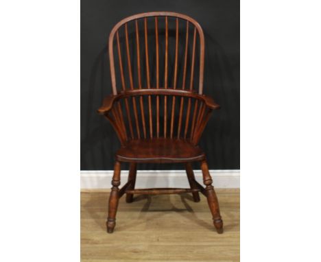 A 19th century ash and elm stick back Windsor elbow chair, hoop back, outswept arms, saddle seat, turned legs, H-stretcher, 1