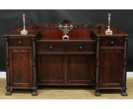 A Post-Regency mahogany sunken-centre serving table or sideboard, shaped half gallery carved with scrolls and acanthus, above