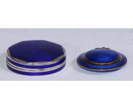 An Art Deco silver and blue guilloche enamel rouge box, hinged cover enclosing a mirror, 5cm diam, London 1928' another, Cont