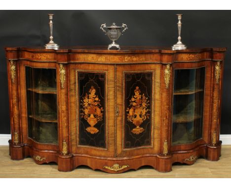 A large Victorian gilt metal mounted walnut and marquetry serpentine credenza, slightly oversailing top above a pair of panel