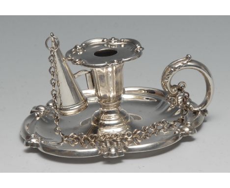 An early Victorian silver shaped circular chamberstick, leafy scroll borders, fluted bell shaped sconce with nozzle, acanthus