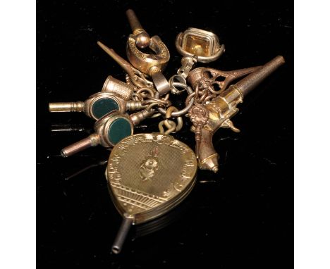 A 19th century gold plated pocket watch key, as a pair of bellows, hand chased and engraved, opening on a hinge as a portrait