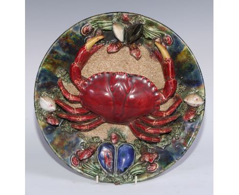 A Portuguese majoilica charger, modelled in the manner of Bernard Palissy with a crab and shellfish, 31cm diam 