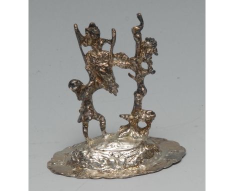 A late Victorian silver miniature model, The Swing, modelled as a playful couple in a garden, the arched base embossed with s