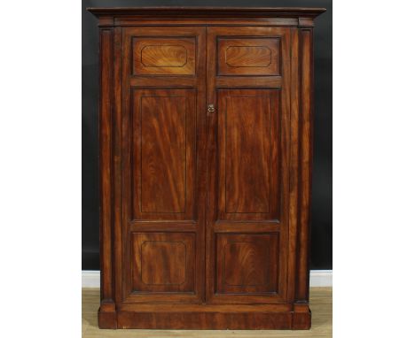 A George III mahogany wardrobe, possibly Channel Islands, moulded cornice above a pair of panel doors, plinth base, 185.5cm h