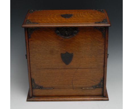 A Victorian oak table top writing cabinet, fall front enclosing a tooled and gilt writing surface, inkwell, pen compartment, 