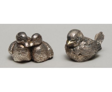An Elizabeth II silver filled model, of a pair of ducks, 5.5cm wide, import mark for London 1992; another, of a bird, 6.5cm l